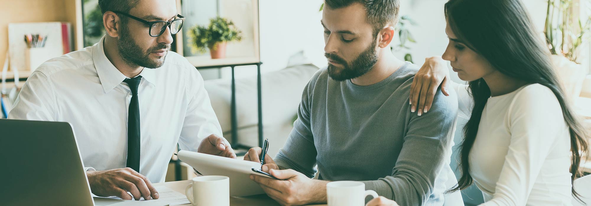 Man Going Over Finances with Couple